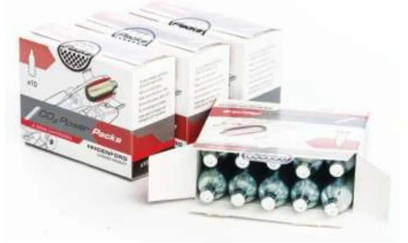 Photograph of boxes of Denford CO2 power packs with one box open, showing a row of small metallic compressed air cartridges inside.